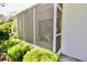 Enclosed screen porch area with ample space and view to landscaped yard at 2836 Featherstone # 2836, Holiday, FL 34691