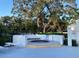 Community spa with established landscaping and seating at 2836 Featherstone # 2836, Holiday, FL 34691
