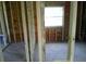 Wood framing shows a window, interior incomplete, showing potential for new design at 2914 N 17Th St, Tampa, FL 33605