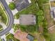 Aerial view of the home and neighboring community and lush landscaping at 3243 Stonegate Falls Dr, Land O Lakes, FL 34638