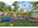 Backyard with a fire pit and ample seating offers a great place to relax and entertain outdoors at 3243 Stonegate Falls Dr, Land O Lakes, FL 34638