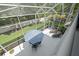 Aerial view of the backyard featuring outdoor seating, a lush yard, and serene views of the surrounding landscape at 3243 Stonegate Falls Dr, Land O Lakes, FL 34638