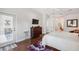 Bedroom with hardwood floors, closet, and television at 3243 Stonegate Falls Dr, Land O Lakes, FL 34638