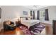 Bedroom with hardwood floors, natural light, and plush decor at 3243 Stonegate Falls Dr, Land O Lakes, FL 34638