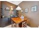 Dining area featuring a bar area and a dark accent wall at 3243 Stonegate Falls Dr, Land O Lakes, FL 34638