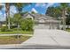 Attractive single-story home with a three-car garage and manicured landscaping at 3243 Stonegate Falls Dr, Land O Lakes, FL 34638