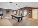 Game room with a pool table and neutral carpeting at 3243 Stonegate Falls Dr, Land O Lakes, FL 34638