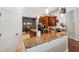 Well-equipped kitchen with granite counters, wood cabinets, and modern appliances at 3243 Stonegate Falls Dr, Land O Lakes, FL 34638