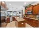 Spacious kitchen with a center island, stainless steel appliances, and an adjacent dining area at 3243 Stonegate Falls Dr, Land O Lakes, FL 34638