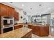 Open-concept kitchen with granite countertops, stainless steel appliances and hardwood floors at 3243 Stonegate Falls Dr, Land O Lakes, FL 34638