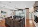 Bright living room with hardwood floors, comfortable sofa, ceiling fan, and plenty of natural light at 3243 Stonegate Falls Dr, Land O Lakes, FL 34638