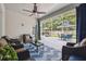 Spacious outdoor seating area with a dining table, seating, and a well-manicured backyard view at 3243 Stonegate Falls Dr, Land O Lakes, FL 34638