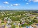 Scenic aerial view of a well-established residential neighborhood with lush greenery at 3468 El Prado Ave, Spring Hill, FL 34609