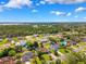 Beautiful aerial view of neighborhood featuring diverse homes and lush green trees at 3468 El Prado Ave, Spring Hill, FL 34609