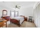 Comfortable bedroom featuring natural light, ceiling fan, and closet at 3468 El Prado Ave, Spring Hill, FL 34609