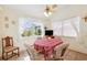 Bright breakfast nook with a ceiling fan, big window, and table for four at 3468 El Prado Ave, Spring Hill, FL 34609
