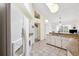 Bright kitchen with vaulted ceiling, tan countertops, and tile flooring at 3468 El Prado Ave, Spring Hill, FL 34609