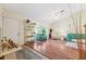 Bright living room with vaulted ceiling, hardwood floors, and an abundance of natural light at 3468 El Prado Ave, Spring Hill, FL 34609