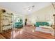 Bright living room with vaulted ceiling, hardwood floors, and an abundance of natural light at 3468 El Prado Ave, Spring Hill, FL 34609