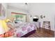 Inviting main bedroom with a ceiling fan and sliding door access to a backyard pool area at 3468 El Prado Ave, Spring Hill, FL 34609