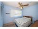 Bedroom with a large window and ceiling fan at 3838 Lanyard Ct # B, New Port Richey, FL 34652