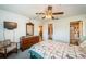 Well-lit bedroom with furniture and connecting bathroom at 3838 Lanyard Ct # B, New Port Richey, FL 34652