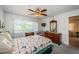 Bright bedroom with a ceiling fan and a spacious dresser at 3838 Lanyard Ct # B, New Port Richey, FL 34652
