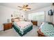 Cozy bedroom with a ceiling fan and natural light at 3838 Lanyard Ct # B, New Port Richey, FL 34652