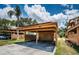 Assigned carport parking area with covered spaces and storage, well maintained landscaping at 3838 Lanyard Ct # B, New Port Richey, FL 34652