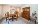 Comfortable dining area featuring a wooden hutch and a round table with seating for a cozy meal at 3838 Lanyard Ct # B, New Port Richey, FL 34652
