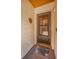 Inviting front door with welcome mat and textured walls; adds a touch of charm to the entryway at 3838 Lanyard Ct # B, New Port Richey, FL 34652