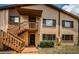 Charming two-story condo with wood stairs leading to the front door and a well-maintained lawn at 3838 Lanyard Ct # B, New Port Richey, FL 34652