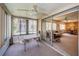 Enclosed Florida room leading into a dining area at 3838 Lanyard Ct # 3838, New Port Richey, FL 34652