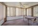Enclosed Florida room with window coverings and a table with chairs at 3838 Lanyard Ct # B, New Port Richey, FL 34652