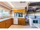 Functional kitchen with wood cabinets, granite countertops, and modern appliances, designed for culinary enthusiasts at 3838 Lanyard Ct # 3838, New Port Richey, FL 34652