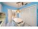 Bright eat-in kitchen features white cabinets, ample storage and sliding glass doors to the outdoors at 3838 Lanyard Ct # B, New Port Richey, FL 34652
