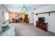 Cozy living and dining area with carpet, and ceiling fan, creating an open and inviting space at 3838 Lanyard Ct # B, New Port Richey, FL 34652