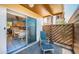 Relaxing patio with seating area and sliding glass doors leading into the kitchen at 3838 Lanyard Ct # B, New Port Richey, FL 34652