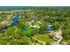 Aerial view of a local park with picnic area, a beautiful lake with walking trails at 4025 Stratfield Dr, New Port Richey, FL 34652