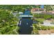 Scenic aerial view of a riverfront area featuring a bridge and waterfront condos and boat dock at 4025 Stratfield Dr, New Port Richey, FL 34652