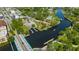 Stunning aerial view of waterfront, bridge, and docks with boat slip, and easy access to the ocean at 4025 Stratfield Dr, New Port Richey, FL 34652