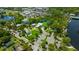 Picturesque aerial view of a park with water access, covered picnic areas, and city views at 4025 Stratfield Dr, New Port Richey, FL 34652