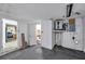Unfinished basement area with access to the kitchen and bathroom at 4025 Stratfield Dr, New Port Richey, FL 34652