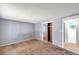 Cozy bedroom offers carpet flooring, ensuite access, and a mirrored closet at 4025 Stratfield Dr, New Port Richey, FL 34652