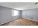 Bedroom boasts natural light, carpeted floors and neutral paint at 4025 Stratfield Dr, New Port Richey, FL 34652