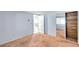 View of the bedroom with peach carpet and a sliding door closet with wood trim at 4025 Stratfield Dr, New Port Richey, FL 34652