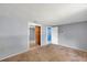 Bedroom with carpet, mirrored closet, and entry to an adjacent room at 4025 Stratfield Dr, New Port Richey, FL 34652