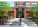 The exterior of a City Hall building with brick facade and stairs leading to the main entrance at 4025 Stratfield Dr, New Port Richey, FL 34652
