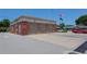 Exterior shot of a fire station with three garage doors, American flags and a red fire engine parked outside at 4025 Stratfield Dr, New Port Richey, FL 34652