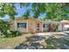 Charming single-story home with an attractive front yard and inviting entrance at 4025 Stratfield Dr, New Port Richey, FL 34652
